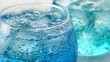 © suyu - Close up of refreshing soda water with bubbles and ice cube in a clear glass, highlighting fizzy drink, sparkling beverage, cool refreshment, summer drink, thirst quenching for cafes or home enjoyment