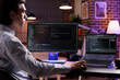 © DC Studio - Male freelancer programming server encryption on firewall software, using security network interface to code system data for app development. Working with binary code text to script program.