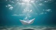 © Tanakorn - Delicate white paper boat sinks in deep blue ocean, symbolizing economic default and impending financial crisis