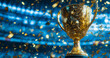 © Karo - Golden trophy with confetti on a blurred background of a sports arena.
