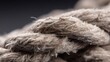 © Chaweewan - Textured Natural Fiber Rope Intertwined in a Close-Up Image Capturing the Intricate Details, Weaving Patterns, and Unique Textures of Traditional Craftsmanship