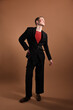 © New Africa - Young man in stylish clothes on brown background