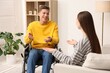 © New Africa - Man in wheelchair with woman at home