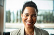 © Marko Geber - Confident smiling businesswoman portrait in modern office
