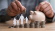 © SKIMP Art - a man is putting coins into his piggy bank next to it, there's an outline of a family and money on top of which they stand background is blurred, focusing attention only on the hands Generative AI