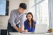 © matinee - Corporate managers reviewing analytics and marketing reports together at office desk. Business growth and teamwork concept.