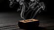 © Frederick - Smoking incense stick in a wooden holder