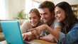 © Aliaksandr Barouski - Three friends smiling together while reviewing travel pictures on a laptop
