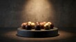 © Zordan - A wide-angle view of an artisanal dark chocolate pedestal holding an assortment of premium chocolate pralines. Truffles and round filled chocolates are arranged elegantly. Soft, focused dramatic light