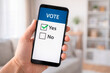 © NikProArt - Man holding smartphone with 'Vote' screen and 'Yes' selected, showing digital voting concept