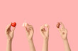 © Pixel-Shot - Female hands with human internal organ models on pink background