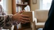© Good Stock - Offering comfort and support a person extends a tissue box to another, symbolizing care and empathy