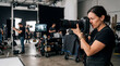 © MI Sumon - Female photographer shooting with professional camera on film set, director, videographer, production crew, behind the scenes, creative industry, media production