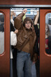 © Lustre Art Group  - Man pressed inside crowded subway carriage holding handle showing tension and urban commuting stress. Concept of pressure, lack of space, daily routine, mental fatigue and city life intensity.