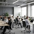 © Rasis - Modern open-plan office with diverse employees working on laptops