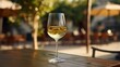 © Magic Stock - A photo of a glass of chilled white wine on a table