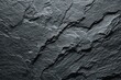 © Hamzah - Dark, fractured slate surface with strong textural elements; diagonal lines abound