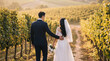 © Darren - Romantic newlywed couple walking hand-in-hand through a beautiful sunlit vineyard after their wedding ceremony.