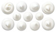 © Sapri - Overhead shot of eleven dollops of white creamy substance on a black background