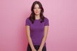 © Mykola - Professional full-length photo of a woman in a purple shirt posed tall against bright pink background