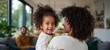 © Z A C - Woman, man, child in living room