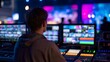 © Ubix - Behind the Scenes: A technician intently monitors multiple screens and controls at a live event, capturing the essence of event production and tech expertise.
