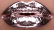 © Amanda - Close-up of metallic chrome lips reflecting light in a fashion editorial photo.