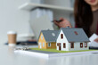 © MIND AND I - Close-up of Miniature House Models on Desk