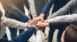 © Creative Saydul  - Diverse group of people stacking hands in a circle for teamwork and unity