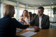 © Nenad - Family couple consultations with a lawyer or insurance agent.