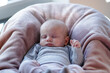 © Budimir Jevtic - Baby sleeps in cozy chair during afternoon light