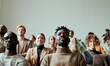 © dreamalittledream - Inclusive Business Community: Low angle view of a diverse team standing together in a minimalist office. Strong theme of equality and corporate inclusion.