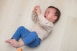 © leungchopan - Little baby lying on floor and crying loudly