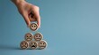 © Muhammad - A human hand places a wooden block with a smiling happy emoji face on top of a pyramid of sad and neutral face blocks against a blue background illust