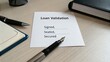 © mat - Loan validation document with signed, sealed, and secured fields on a desk with a pen and notebook for financial context