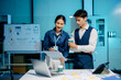 © Nuttapong punna - Business professionals reviewing financial reports, signing documents, and analyzing data together, highlighting teamwork, strategy, and corporate in office