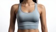 © maxximmm - A woman is wearing a light blue athletic top. The athletic top fits snugly, highlighting the woman's physique and suggesting an active lifestyle.