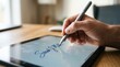 © Justlight - Closeup of digital signature on tablet screen for enrolling in debt management plan foreground crisp with stylus in motion background softly blurred.