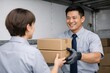© VideoFlow - Delivery worker handing cardboard packages to colleague inside truck bay. Ai generative