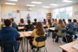 © Natasa - Abstract blur image of classroom with students and teacher for background usage