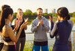 © Studio Romantic - Sporty group celebrating win, happy fit active friends applauding, people enjoy after running together outdoors, participating in fitness activity in fresh air, exercise, positive teamwork fun
