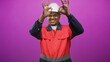 © Krakenimages.com - Man construction worker in hard hat and red uniform makes ok signs with both hands in studio; cheerful confidence.