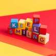 © Giorgi - keep smiling colorful blocks on red yellow background