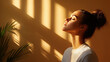 © syhin_stas - Young woman closing her eyes, tilting her head back, enjoying the warm golden sunlight on her face, feeling peaceful and mindful while waking up to a new day