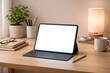 © Татьяна Евдокимова - Tablet computer with a blank white screen, styled with a keyboard and stylus, sitting on a natural wooden desk in a modern home office setting, ready for remote work or studying