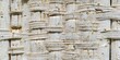 © antishock - Woven texture, light color, closeup view. Rustic material shows interlaced pattern, possibly basket fragment or furniture detail.
