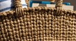 © enggar - Close-up of woven straw tote bag.