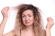 © New Africa - Unhappy woman with tangled hair on white background