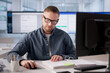 © Andrey Popov - Chartered Accountant Analyzing Tax Files Via Cloud Accounting