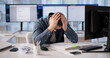 © Andrey Popov - Accountant Overwhelmed By Persistent Software Glitches Leading To Stress